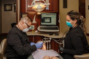 Serenity Advanced Dentistry dentists performing dental treatments